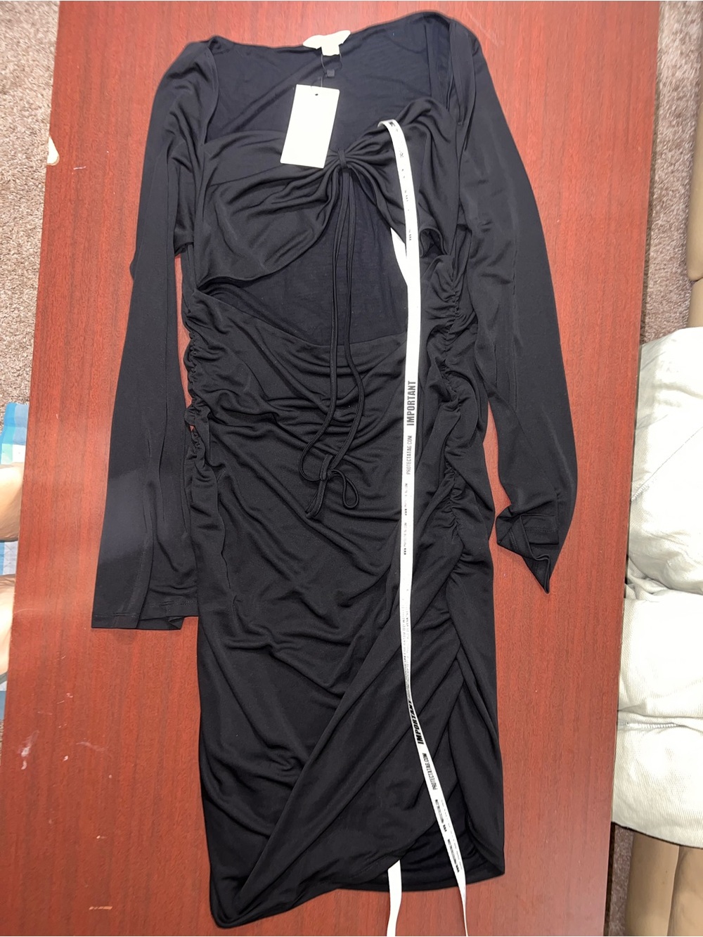 Black Long-Sleeve Cutout Mini Dress with Strap Detail - Picture 2 of 4